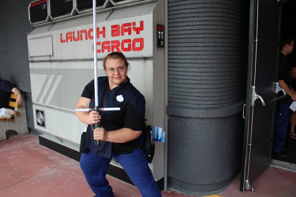 Launch Bay Cast member with lightsaber