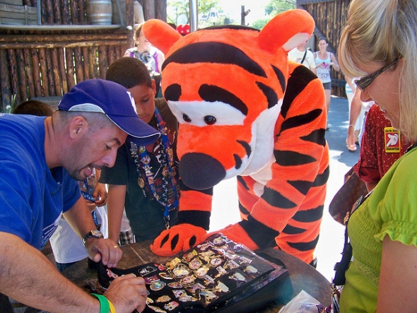 Tigger checking out trading pins with guest