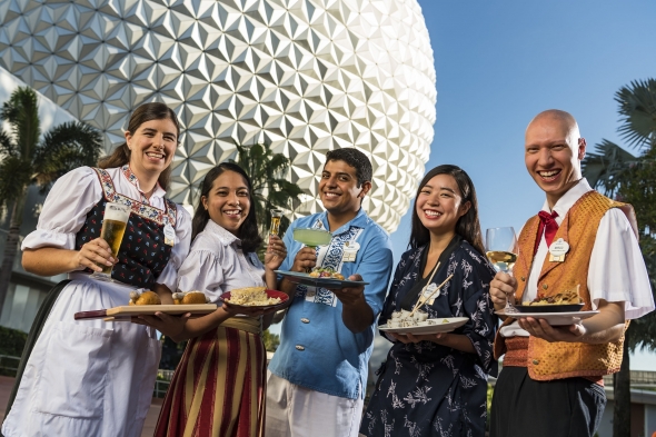 World Showcase cast members with food plates