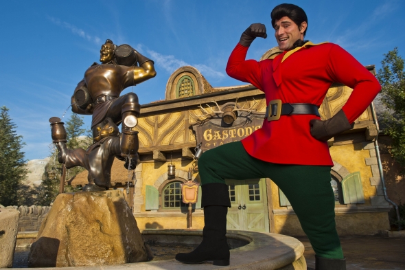 Gaston poses next to his statue