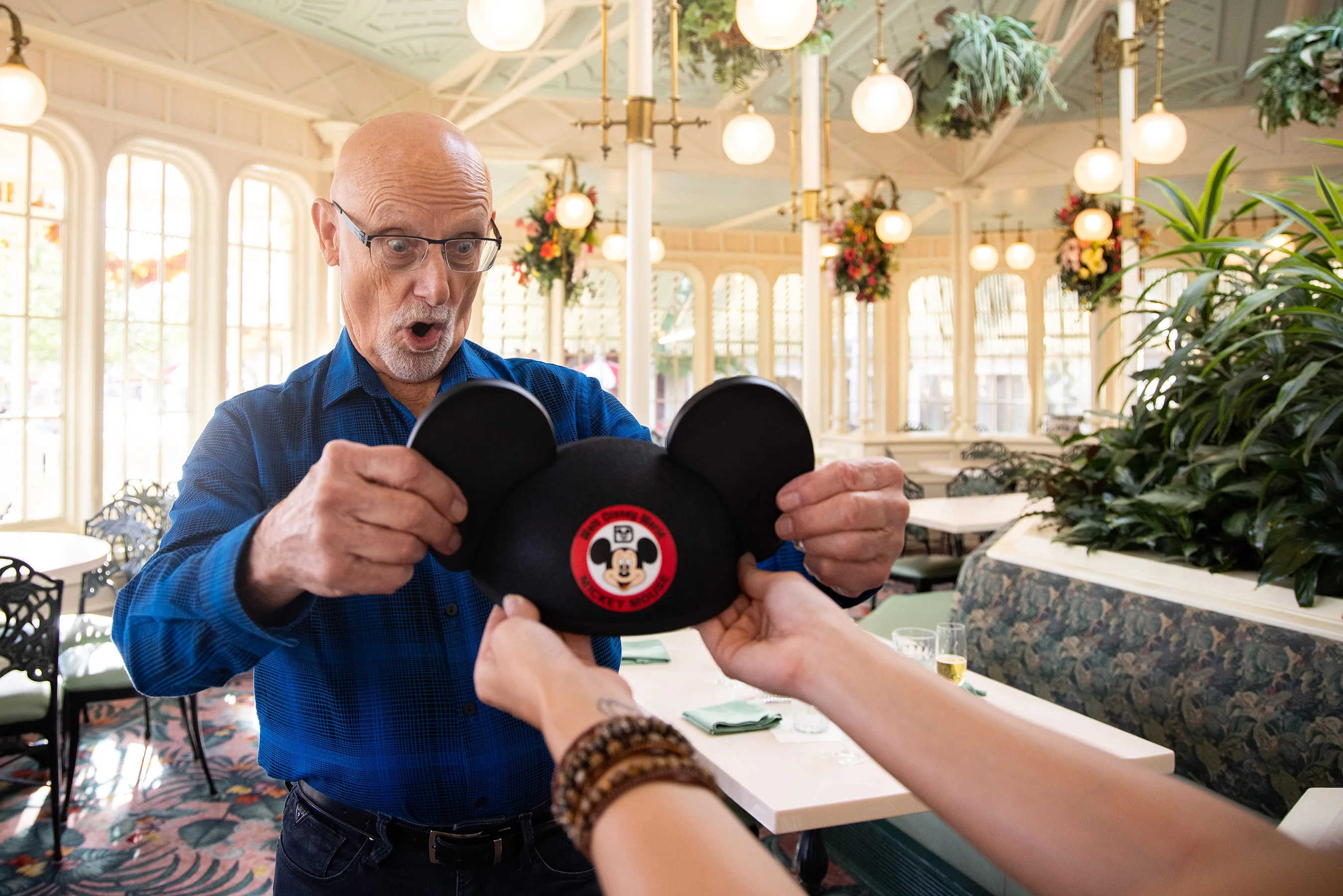 Cast member very excited to receive vintage Mickey ears