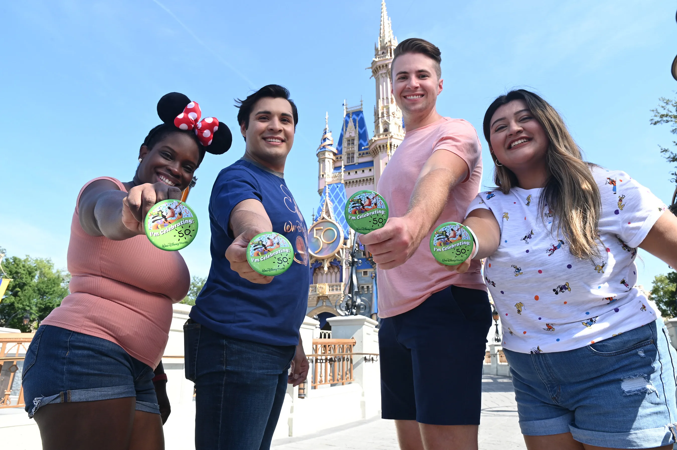 Friend with celebration buttons at Disney World