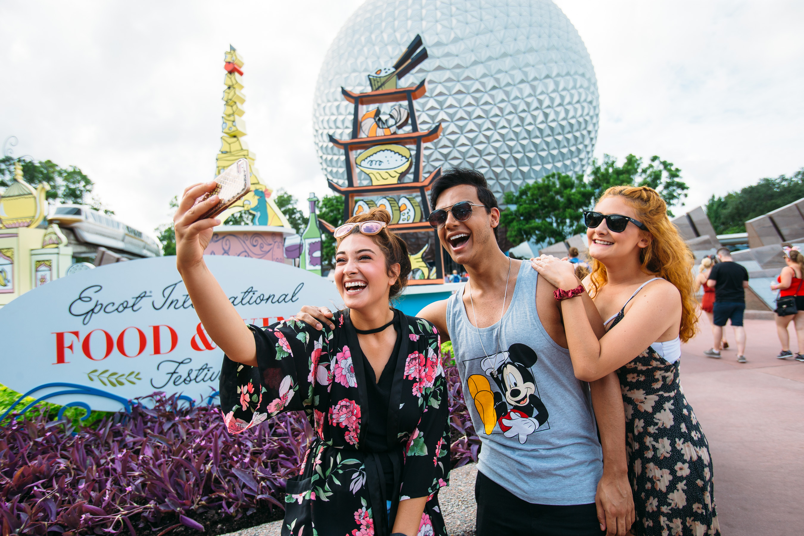 Adult friends taking a selfie at Epcot Food and Wine Festival