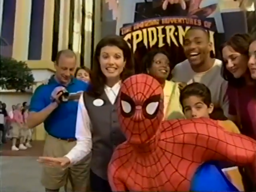 A tour group posing with Spider-Man.