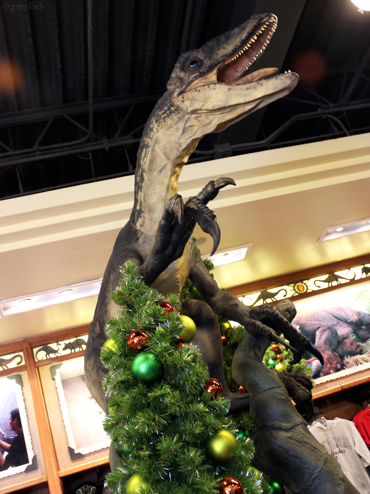 A velociraptor in a Christmas tree