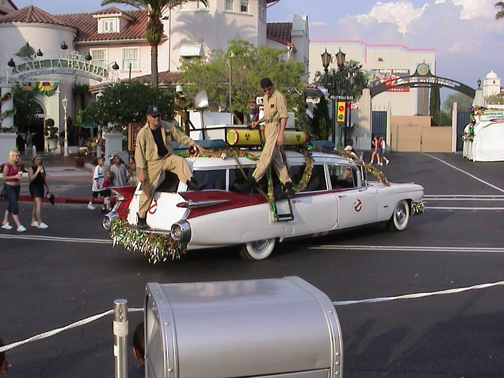 the Ghostbusters riding around in a festive Ecto-1