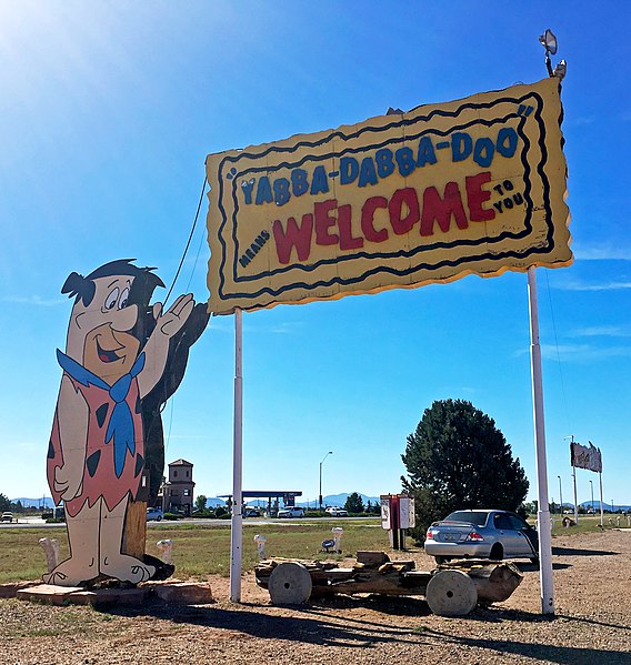 Fred Flintstone cutout welcoming guests to Bedrock City