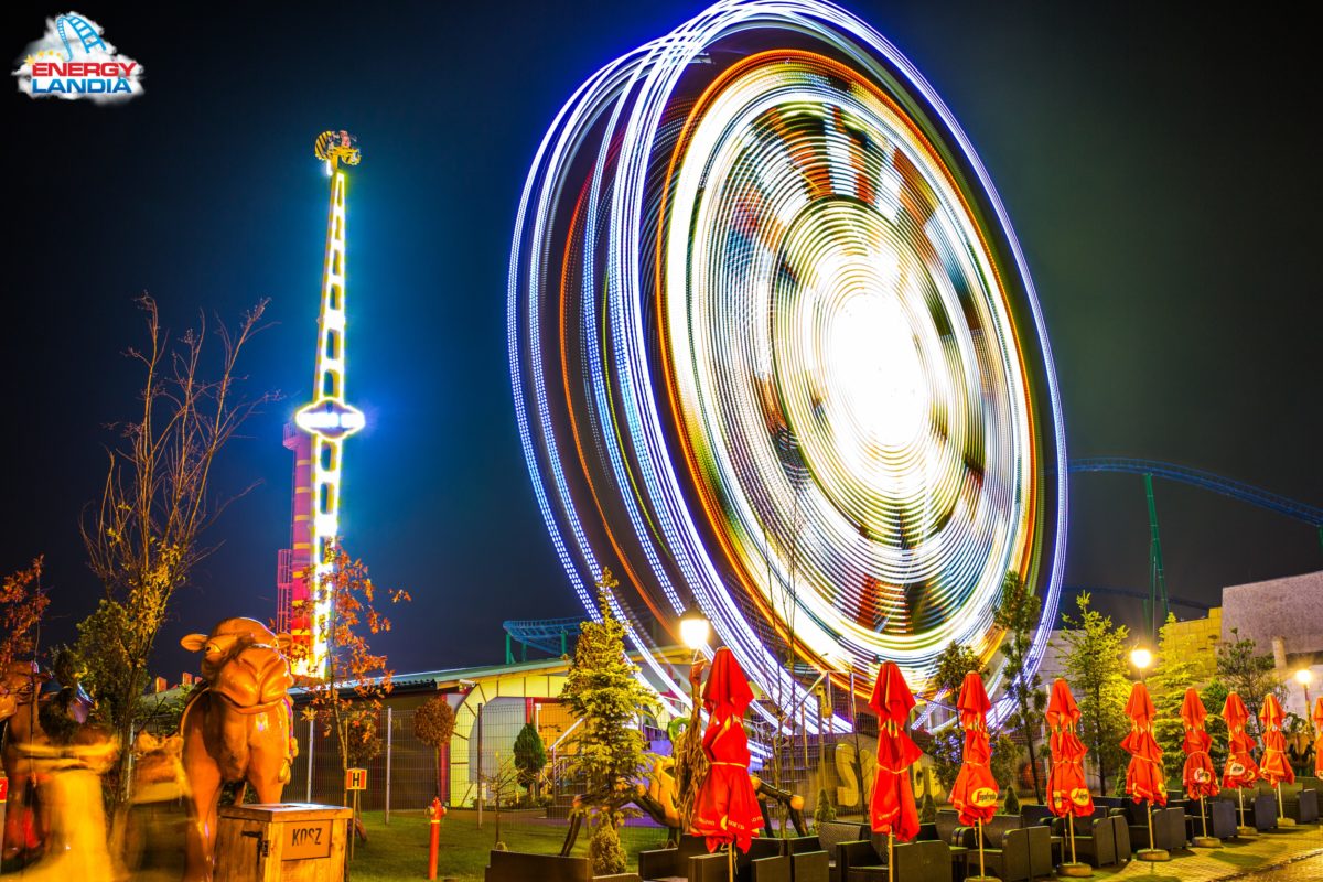 Energylandia's flat rides spinning in the night
