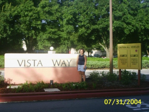 Brandice with Vista Way entrance sign
