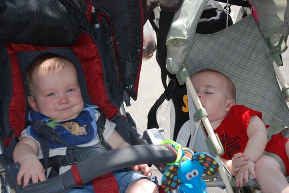 Two baby friends in strollers (one is asleep)