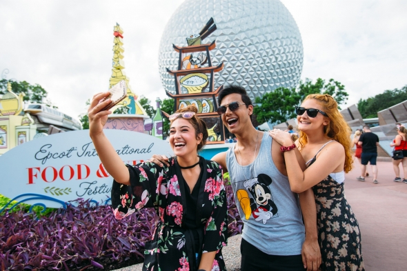 Friends taking selfie at Epcot Food and Wine Fest