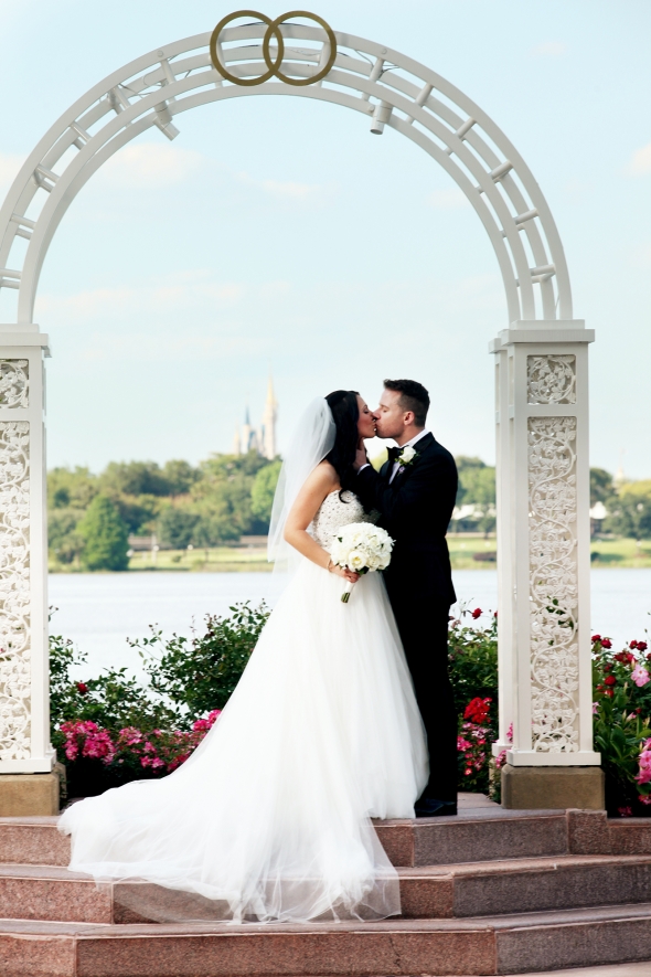 Couple kissing on wedding day at Disney World