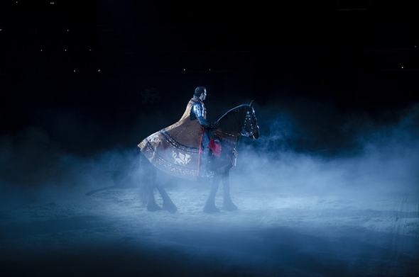 Knight on black horse surrounded by fog at Medieval Times