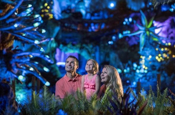 Family in Pandora at night with small girl