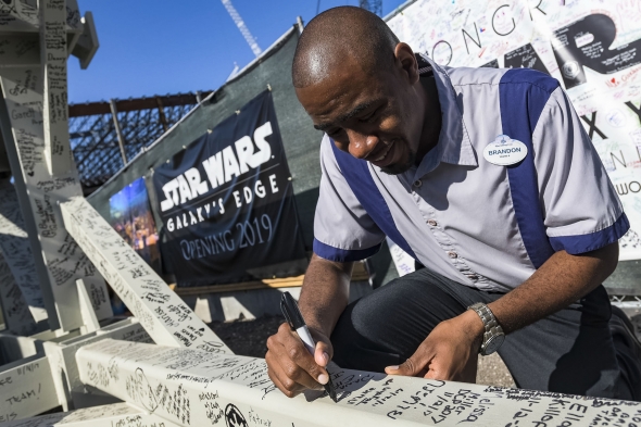Cast Member signing beam for Galaxy's Edge