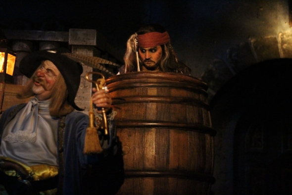Captain Jack peering out of barrel