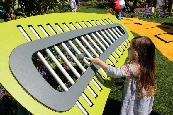 Girl playing giant xylophone at Epcot